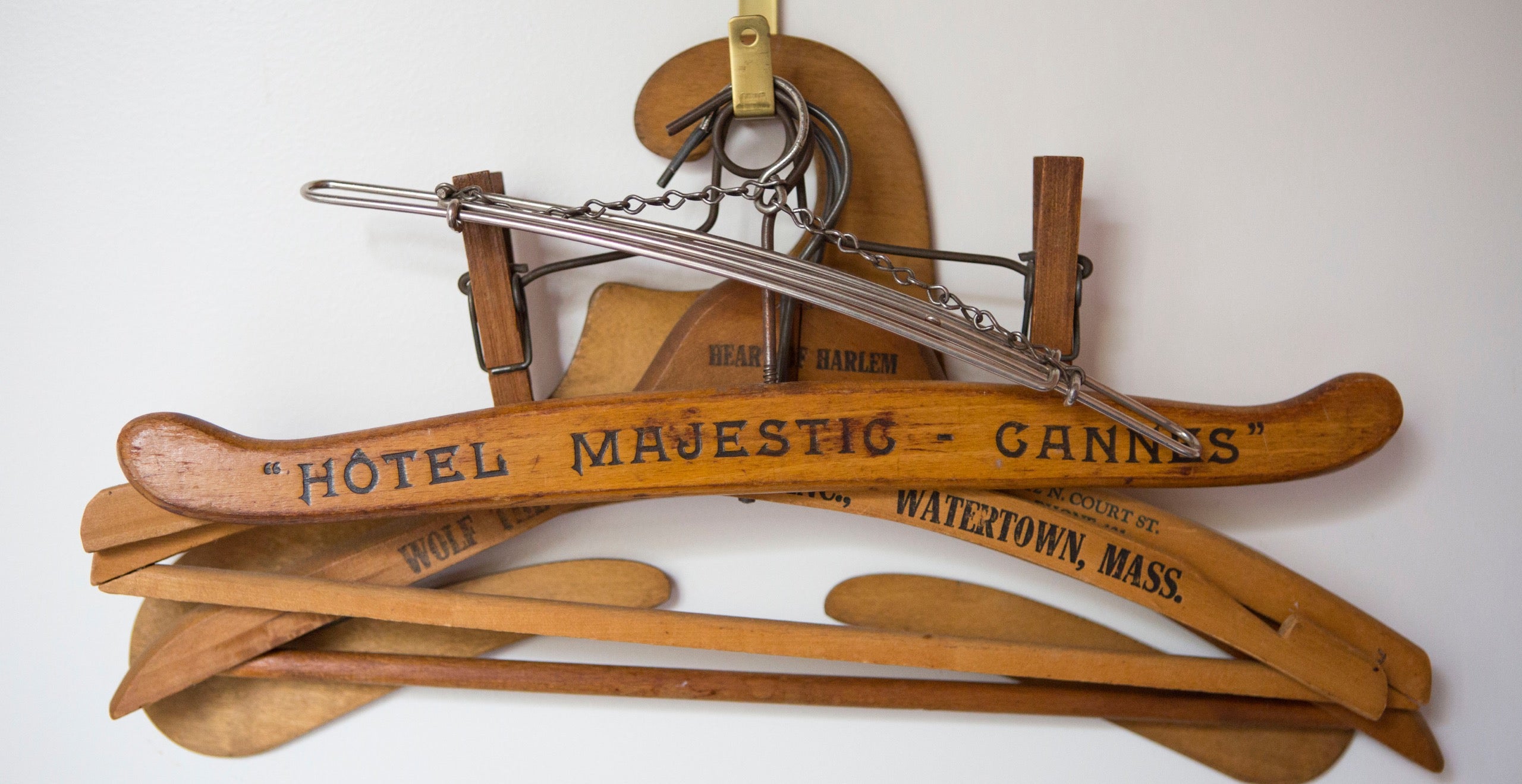 A testament to Corrine Warner&rsquo;s love of simple utility items is her collection of old wooden coat hangers hanging on a hook in her bedroom. She is particularly drawn to peculiar shapes and those advertising exotic locales from Cannes to Harlem